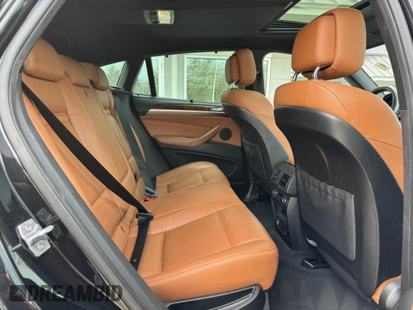 2014 BMW X6 xDrive35i z VIN 5UXFG2C57E0K41455, wystawiony jako Copart lot #58616315 z przebiegiem 162 232 mil mil oraz Czysty tytuł • Clean title. Historia ofert i sprzedaży dostępna na DreamBid. Obrazek 6.