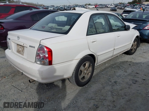 2000 Mazda Protege DX with VIN JM1BJ2221Y0208156, listed as a IAAI auction lot 41609657 with 435,304 mi miles and . Bid and sale history available at DreamBid. Image 4.