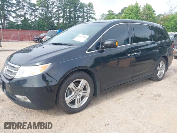 2011 Honda Odyssey Touring with VIN 5FNRL5H90BB070472, listed as a IAAI auction lot 42367710 with 203,589 mi miles and . Bid and sale history available at DreamBid. Image 2.