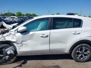 2021 Kia Sportage LX with VIN KNDPM3AC8M7932425, listed as a IAAI auction lot 39067549 with 56,841 mi miles. Bid and sale history available at carsss.com. Image 13.