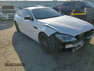 2015 BMW M6 z VIN WBSLX9C51FD160757, wystawiony jako Copart lot #51991315 z przebiegiem 71 133 mil mil oraz Szkoda całkowita • Salvage title. Historia ofert i sprzedaży dostępna na DreamBid. Obrazek 11.
