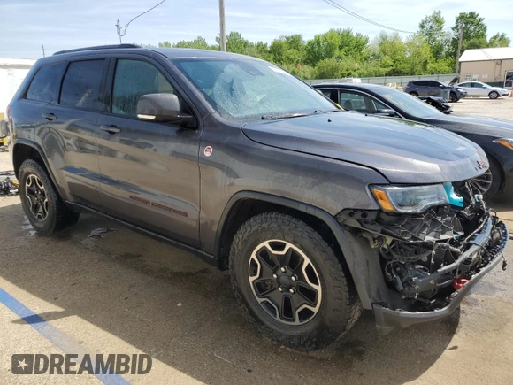 2017 Jeep Grand Cherokee Trailhawk with VIN 1C4RJFLGXHC654112, listed as a Copart auction lot 56397195 with 168,136 mi miles and Salvage title. Bid and sale history available at DreamBid. Image 4.