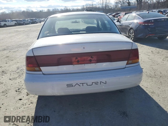 1996 Saturn SL with VIN 1G8ZK5279TZ162812, listed as a Copart auction lot 87079874 with 143,461 mi miles and Salvage title. Bid and sale history available at DreamBid. Image 6.