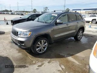 2012 Jeep Grand Cherokee Laredo with VIN 1C4RJEAG1CC306950, listed as a Copart auction lot 84912434 with 128,659 mi miles and Salvage Title. Bid and sale history available at carsss.com. Image 1.