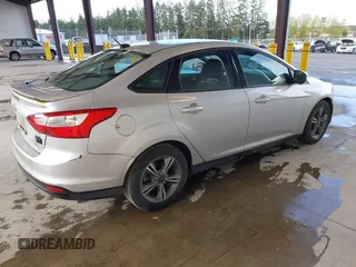 2014 Ford Focus SE with VIN 1FADP3F28EL433519, listed as a IAAI auction lot 41969007 with 137,064 mi miles. Bid and sale history available at carsss.com. Image 4.