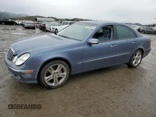 2004 Mercedes-Benz E-Class 5.0L with VIN WDBUF70J94A406133, listed as a Copart auction lot 44396845 with 123,999 mi miles and Salvage Title. Bid and sale history available at carsss.com. Image 1.