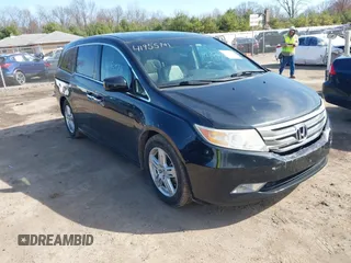 2011 Honda Odyssey Touring with VIN 5FNRL5H97BB037713, listed as a IAAI auction lot 41955741 with 215,536 mi miles and . Bid and sale history available at DreamBid. Image 1.