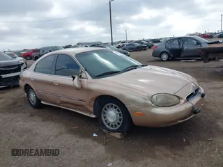 1997 Mercury Sable LS z VIN 1MELM53S8VA602057, wystawiony jako IAAI lot #41468005 z przebiegiem 71 203 mil mil oraz . Historia ofert i sprzedaży dostępna na DreamBid. Obrazek 13.