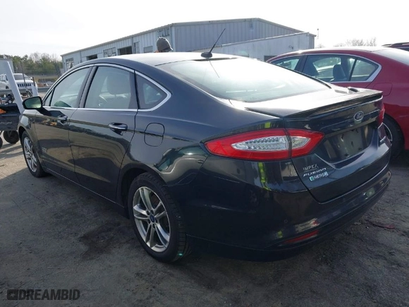 2015 Ford Fusion Energi Titanium with VIN 3FA6P0SU8FR189159, listed as a IAAI auction lot 41595744 with 170,558 mi miles. Bid and sale history available at carsss.com. Image 3.