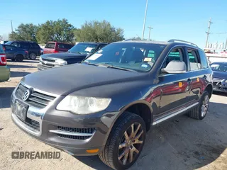 2010 Volkswagen Touareg VR6 with VIN WVGBF7A95AD002412, listed as a IAAI auction lot 41259491 with 94,104 mi miles and . Bid and sale history available at DreamBid. Image 2.