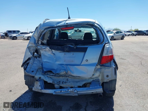 2009 Honda Fit z VIN JHMGE88259S037601, wystawiony jako IAAI lot #42428704 z przebiegiem 55 823 mil mil oraz . Historia ofert i sprzedaży dostępna na DreamBid. Obrazek 17.