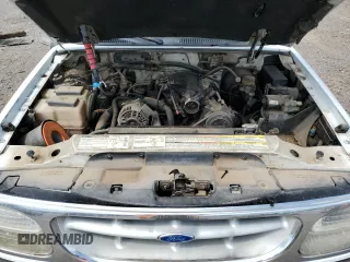 1996 Ford Explorer XL z VIN 1FMDU34X7TUD53066, wystawiony jako Copart lot #52031465 z przebiegiem 142 895 mil mil oraz Szkoda całkowita • Salvage title. Historia ofert i sprzedaży dostępna na DreamBid. Obrazek 12.