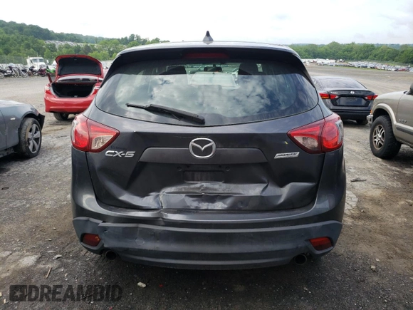 2014 Mazda CX-5 Sport with VIN JM3KE2BE9E0372370, listed as a Copart auction lot 58980165 with 175,477 mi miles and Salvage title. Bid and sale history available at DreamBid. Image 6.