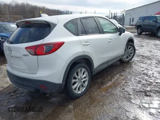 2014 Mazda CX-5 Grand Touring with VIN JM3KE4DY9E0300491, listed as a IAAI auction lot 41657153 with 157,394 mi miles and . Bid and sale history available at DreamBid. Image 4.