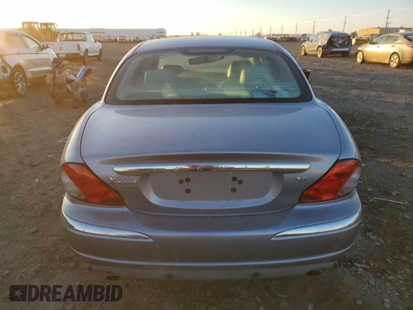 2007 Jaguar X-Type z VIN SAJWA51A27WJ21259, wystawiony jako Copart lot #42643115 z przebiegiem 106 800 mil mil oraz Szkody całkowita. Historia ofert i sprzedaży dostępna na DreamBid. Obrazek 6.