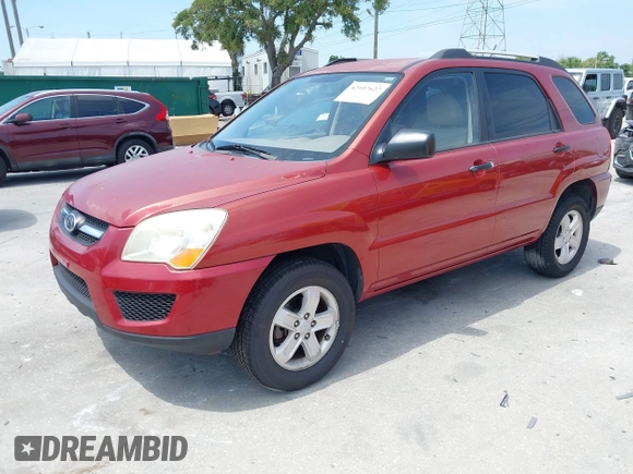 2009 Kia Sportage LX with VIN KNDJE723897599966, listed as a IAAI auction lot 42107627 with 118,512 mi miles. Bid and sale history available at carsss.com. Image 2.