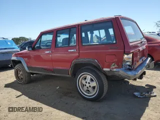 1992 Jeep Cherokee with VIN 1J4FJ58S0NL140995, listed as a Copart auction lot 56705875 with 253,657 mi miles and Salvage title. Bid and sale history available at DreamBid. Image 2.