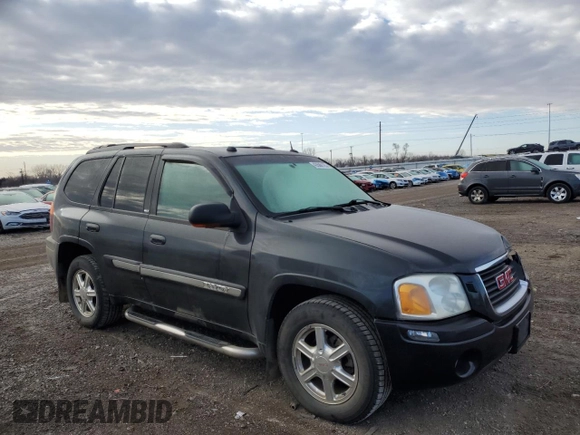 2005 GMC Envoy SLT with VIN 1GKDT13S552310799, listed as a Copart auction lot 43586125 with 182,928 mi miles and Salvage Title. Bid and sale history available at carsss.com. Image 4.