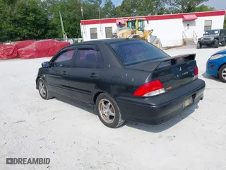 2002 Mitsubishi Lancer OZ-Rally with VIN JA3AJ86E22U074890, listed as a IAAI auction lot 42029591 with 235,818 mi miles. Bid and sale history available at carsss.com. Image 3.