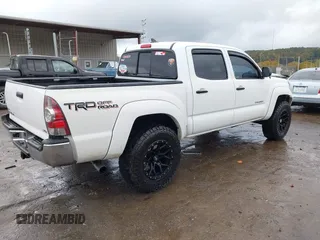 2014 Toyota Tacoma with VIN 3TMLU4EN9EM140999, listed as a IAAI auction lot 37765514 with 168,875 mi miles. Bid and sale history available at carsss.com. Image 4.