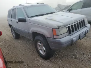 1997 Jeep Grand Cherokee Laredo with VIN 1J4GZ58Y6VC603370, listed as a Copart auction lot 82802794 with 0 mi miles and Salvage Title. Bid and sale history available at carsss.com. Image 4.
