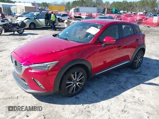 2016 Mazda CX-3 Grand Touring with VIN JM1DKFD72G0129096, listed as a IAAI auction lot 41592893 with 144,860 mi miles. Bid and sale history available at carsss.com. Image 2.