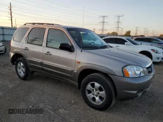 2002 Mazda Tribute LX with VIN 4F2YU09142KM22895, listed as a Copart auction lot 73797364 with 176,514 mi miles and Salvage Title. Bid and sale history available at carsss.com. Image 4.