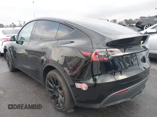 2023 Tesla Model Y Long Range with VIN 7SAYGDEE2PA024032, listed as a IAAI auction lot 41213403 with 23,418 mi miles and . Bid and sale history available at DreamBid. Image 14.