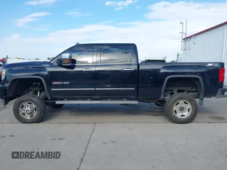2015 GMC Sierra 2500HD SLT with VIN 1GT12ZE87FF552599, listed as a IAAI auction lot 40054977 with 146,190 mi miles and . Bid and sale history available at DreamBid. Image 13.