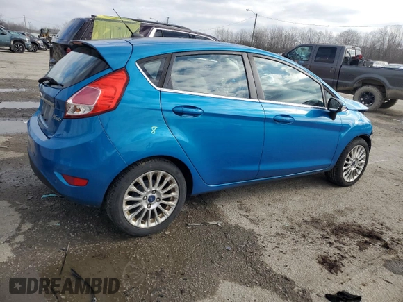 2015 Ford Fiesta Titanium z VIN 3FADP4FJ7FM120958, wystawiony jako Copart lot #85260204 z przebiegiem 144 587 mil mil oraz Szkoda całkowita • Salvage title. Historia ofert i sprzedaży dostępna na DreamBid. Obrazek 3.