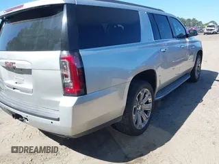 2015 GMC Yukon XL SLT with VIN 1GKS1HKC8FR221608, listed as a IAAI auction lot 42044318 with 215,757 mi miles. Bid and sale history available at carsss.com. Image 4.
