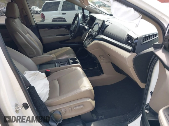 2021 Honda Odyssey Touring with VIN 5FNRL6H80MB010952, listed as a IAAI auction lot 42080412 with 90,594 mi miles and . Bid and sale history available at DreamBid. Image 5.