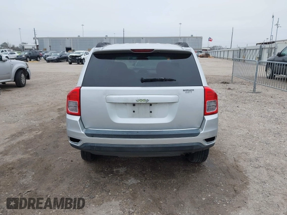 2011 Jeep Compass with VIN 1J4NT1FA7BD142600, listed as a IAAI auction lot 41590661 with 266,600 mi miles. Bid and sale history available at carsss.com. Image 17.