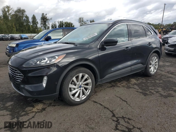 2021 Ford Escape Titanium with VIN 1FMCU9J98MUA73257, listed as a Copart auction lot 74838394 with 41,294 mi miles and Salvage Title. Bid and sale history available at carsss.com. Image 1.