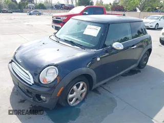 2009 MINI Hardtop with VIN WMWMF33589TW70400, listed as a IAAI auction lot 42055596 with 118,543 mi miles and . Bid and sale history available at DreamBid. Image 2.