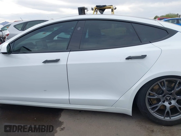 2021 Tesla Model S Long Range with VIN 5YJSA1E57MF453815, listed as a IAAI auction lot 41818700 with 51,176 mi miles and . Bid and sale history available at DreamBid. Image 15.