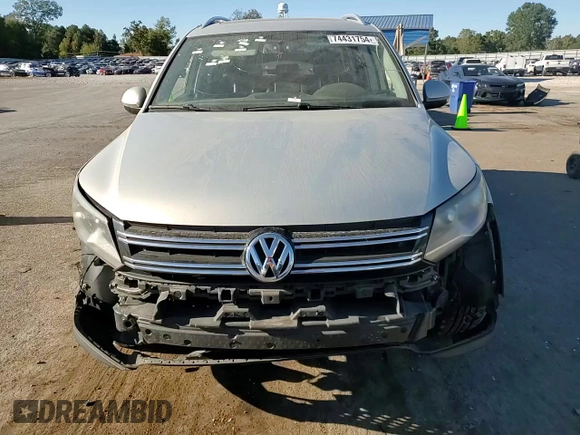 2014 Volkswagen Tiguan SE with VIN WVGAV3AX9EW611860, listed as a Copart auction lot 74431754 with 116,022 mi miles and Salvage title. Bid and sale history available at DreamBid. Image 12.