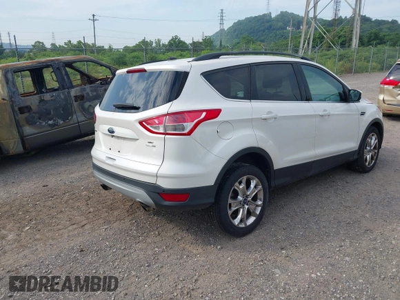 2014 Ford Escape SE with VIN 1FMCU9G99EUA09575, listed as a IAAI auction lot 42615476 with 107,948 mi miles and . Bid and sale history available at DreamBid. Image 4.