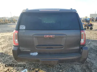 2015 GMC Yukon SLT with VIN 1GKS1BKC0FR735059, listed as a Copart auction lot 42960685 with 242,220 mi miles and Salvage Title. Bid and sale history available at carsss.com. Image 6.