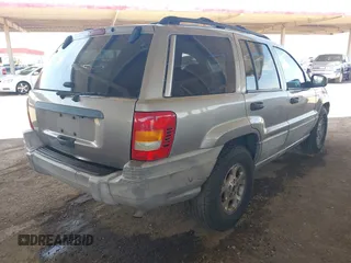 1999 Jeep Grand Cherokee Laredo with VIN 1J4G258S7XC679151, listed as a IAAI auction lot 42500706 with Not provided miles and . Bid and sale history available at DreamBid. Image 4.