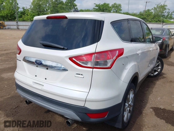 2013 Ford Escape SEL with VIN 1FMCU9HX6DUB14053, listed as a IAAI auction lot 42361297 with 144,861 mi miles and . Bid and sale history available at DreamBid. Image 4.