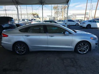 2019 Ford Fusion Hybrid Titanium with VIN 3FA6P0RU1KR217478, listed as a IAAI auction lot 41625872 with 87,059 mi miles. Bid and sale history available at carsss.com. Image 13.