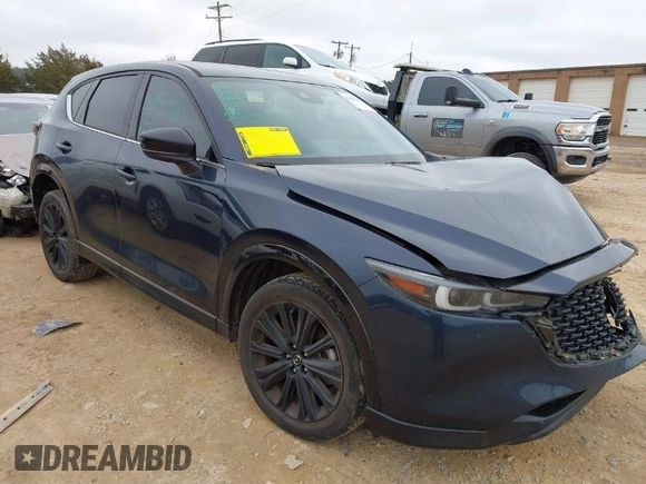 2022 Mazda CX-5 2.5 Turbo with VIN JM3KFBAY5N0521947, listed as a IAAI auction lot 41424202 with 43,961 mi miles and . Bid and sale history available at carsss.com. Image 1.