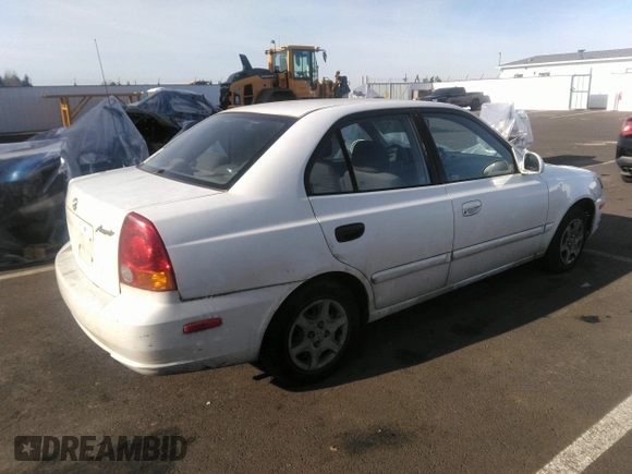 2004 Hyundai Accent GL with VIN KMHCG45C04U498939, listed as a IAAI auction lot 41384821 with 247,994 mi miles. Bid and sale history available at carsss.com. Image 4.