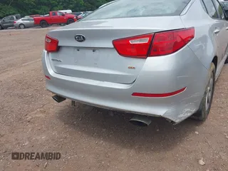 2015 Kia Optima LX z VIN 5XXGM4A70FG385024, wystawiony jako IAAI lot #42256238 z przebiegiem 162 395 mil mil oraz . Historia ofert i sprzedaży dostępna na DreamBid. Obrazek 13.