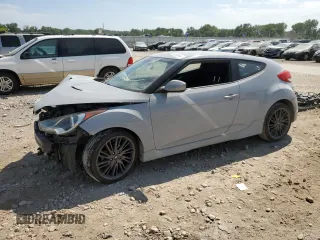 2013 Hyundai Veloster w/Gray Int z VIN KMHTC6AD0DU126717, wystawiony jako Copart lot #65536944 z przebiegiem 89 662 mil mil oraz Szkoda całkowita • Salvage title. Historia ofert i sprzedaży dostępna na DreamBid. Obrazek 1.
