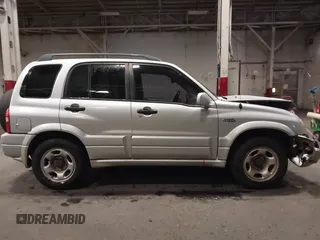 2002 Suzuki Grand Vitara JLX z VIN JS3TD62V324161291, wystawiony jako IAAI lot #41577344 z przebiegiem 164 658 mil mil oraz . Historia ofert i sprzedaży dostępna na DreamBid. Obrazek 13.