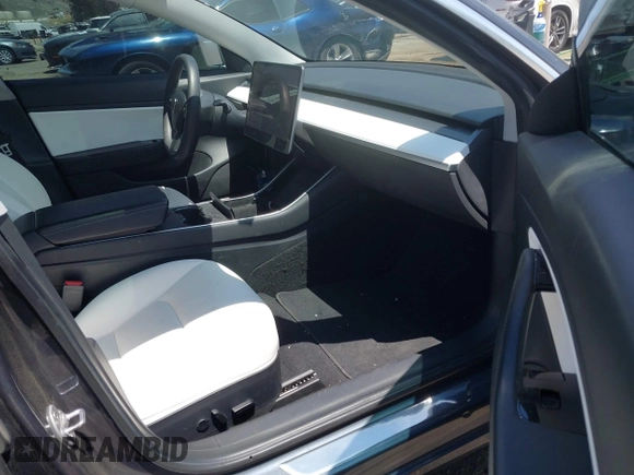 2020 Tesla Model 3 Standard Range Plus with VIN 5YJ3E1EAXLF615781, listed as a IAAI auction lot 42068935 with 96,026 mi miles. Bid and sale history available at carsss.com. Image 5.