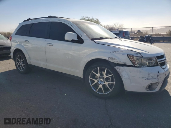 2013 Dodge Journey R/T with VIN 3C4PDCEG3DT659001, listed as a Copart auction lot 78187554 with 128,052 mi miles and Salvage title. Bid and sale history available at DreamBid. Image 4.