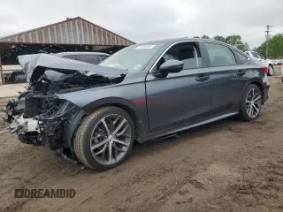 2023 Honda Civic Touring z VIN 2HGFE1F97PH306921, wystawiony jako Copart lot #51484885 z przebiegiem 39 949 mil mil oraz Szkoda całkowita • Salvage title. Historia ofert i sprzedaży dostępna na DreamBid. Obrazek 1.